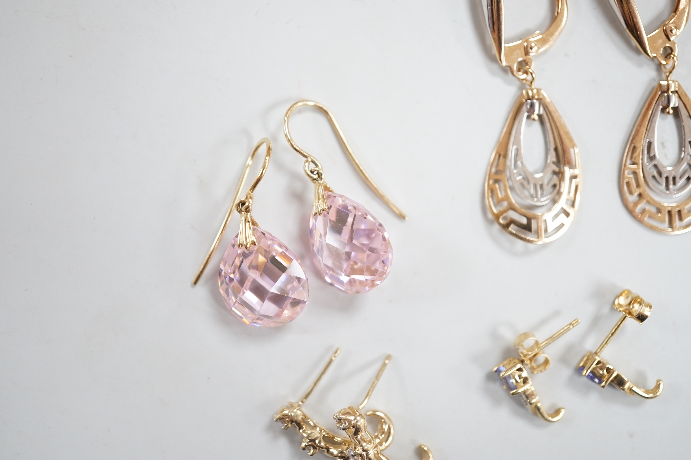 Two modern pairs of 14k drop earrings including pink cubic zirconia, 15mm, gross weight 10.1 grams, two similar pairs of 10k and gem set earrings, gross weight 2.7 grams and a modern pair of yellow metal and opal cluster